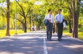 Businessman,They are walking on road in park.They are talking  business. Royalty Free Stock Photo