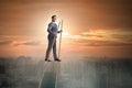 The businessman walking on stilts - standing out from the crowd Royalty Free Stock Photo