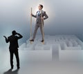 Businessman walking on stilts - standing out from the crowd Royalty Free Stock Photo