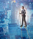 Businessman walking on stilts - standing out from the crowd Royalty Free Stock Photo
