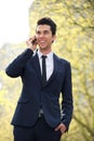 Businessman walking and talking on the phone Royalty Free Stock Photo