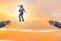 Businessman walking on tight rope Royalty Free Stock Photo