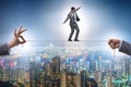 Businessman walking on tight rope Royalty Free Stock Photo
