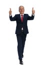 Businessman walking towards the camera and giving a thumbs up Royalty Free Stock Photo