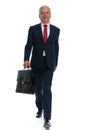 Businessman walking towards the camera with his briefcase in hand Royalty Free Stock Photo