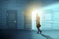 The businessman walking towards open door Royalty Free Stock Photo