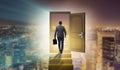 The businessman walking towards open door Royalty Free Stock Photo