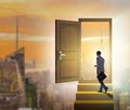 Businessman walking towards open door Royalty Free Stock Photo