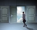 Businessman walking towards open door Royalty Free Stock Photo