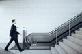 Businessman walking in train station interior Royalty Free Stock Photo