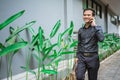 Businessman walking trough sidewalk smiling going to office with phone Royalty Free Stock Photo