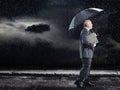 Businessman Walking Under Umbrella In Rain Royalty Free Stock Photo