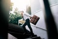 Businessman walking up on stairs and holding briefcase Royalty Free Stock Photo