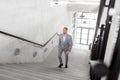 Businessman walking upstairs Royalty Free Stock Photo