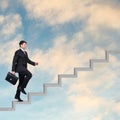 Businessman walking upstairs Royalty Free Stock Photo