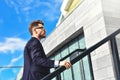 Businessman walking upstairs in an office park. Royalty Free Stock Photo