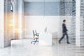 Businessman walking in white open space office Royalty Free Stock Photo