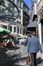 Businessman walks in Chancery Square Auckland New Zealand