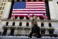 Businessman walks in the New York stock exchange