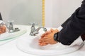 Businessman washing hands