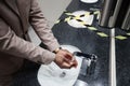 Businessman Washing Hands in Public Restroom