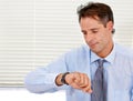 Businessman, watch and late for office job and appointment or schedule at looking serious. Time, alarm and male person Royalty Free Stock Photo