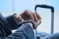 Businessman watching his watch at the airport Royalty Free Stock Photo