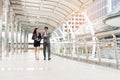 Businessman watching the watch and and his secretary are hustling in rush hour Royalty Free Stock Photo