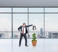 Businessman watering money, growth Royalty Free Stock Photo