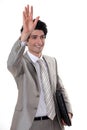 A businessman waving Royalty Free Stock Photo