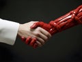 businessman wear white suit shaking hands with red hand of robot, close-up hand. successful, handshaking