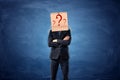 Businessman is wearing cardboard box with drawn question marks on his head Royalty Free Stock Photo