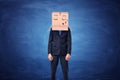 Businessman is wearing cardboard box on head with sleepy face Royalty Free Stock Photo