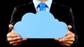 Cloud Computing Concept Business Man Holding a Blue Cloud Symbol Against a Black Background Displaying Connectivity and Modern Royalty Free Stock Photo