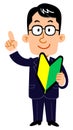 A businessman wearing eyeglasses who stands a forefinger with a beginner`s mark