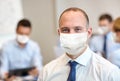 Businessman wearing face protective mask at office