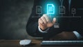Businessman wearing formal suits pointing to holograms of digital document files, data files on computers stored as cloud Royalty Free Stock Photo