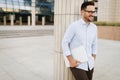 Businessman wearing glasses holding tablet Royalty Free Stock Photo