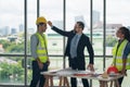 Businessman wearing hard safety helmet hat for safety project of workman as engineer or worker Royalty Free Stock Photo