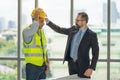 Businessman wearing hard safety helmet hat for safety project of workman as engineer or worker Royalty Free Stock Photo