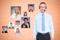 Businessman wearing headphones with colleagues showing various expressions Royalty Free Stock Photo