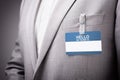 Businessman wearing Hello my name is tag