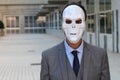 Businessman wearing a horrible mask Royalty Free Stock Photo