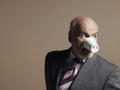 Businessman Wearing Plastic Cup as Pig Snout Royalty Free Stock Photo