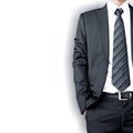 Businessman wearing suit & tie standing on white background Royalty Free Stock Photo
