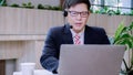 Businessman wearing telephone headset talking to caller in customer services department. Royalty Free Stock Photo