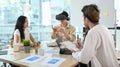 Businessman wearing virtual reality headset at business meeting. Teamwork, startup, innovation concept Royalty Free Stock Photo