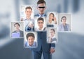 Businessman wearing Virtual reality headset interacting and choosing a person from group of people i Royalty Free Stock Photo