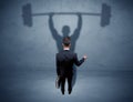 Businessman with weight lifting shadow Royalty Free Stock Photo