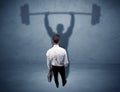 Businessman with weight lifting shadow Royalty Free Stock Photo